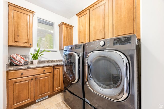 1263 E Wild Maple Ct, Draper, UT 84020 - laundry area with cabinet space, stone finish flooring, visible vents, and washer and dryer