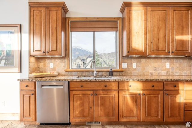 1263 E Wild Maple Ct, Draper, UT 84020 - kitchen featuring brown cabinetry, visible vents, dishwasher, a sink, and light stone counters