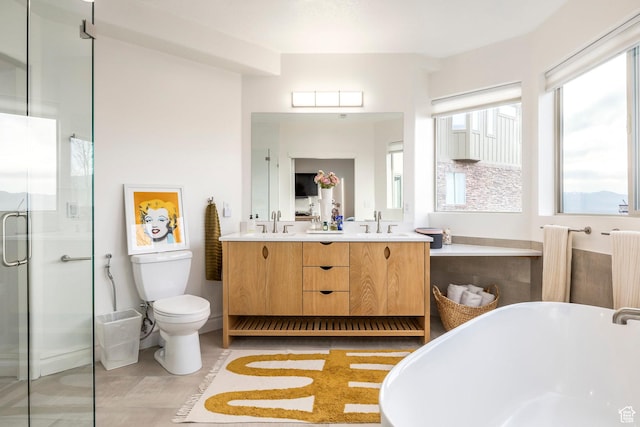 1263 E Wild Maple Ct, Draper, UT 84020 - full bathroom with a sink, double vanity, toilet, a freestanding tub, and a stall shower