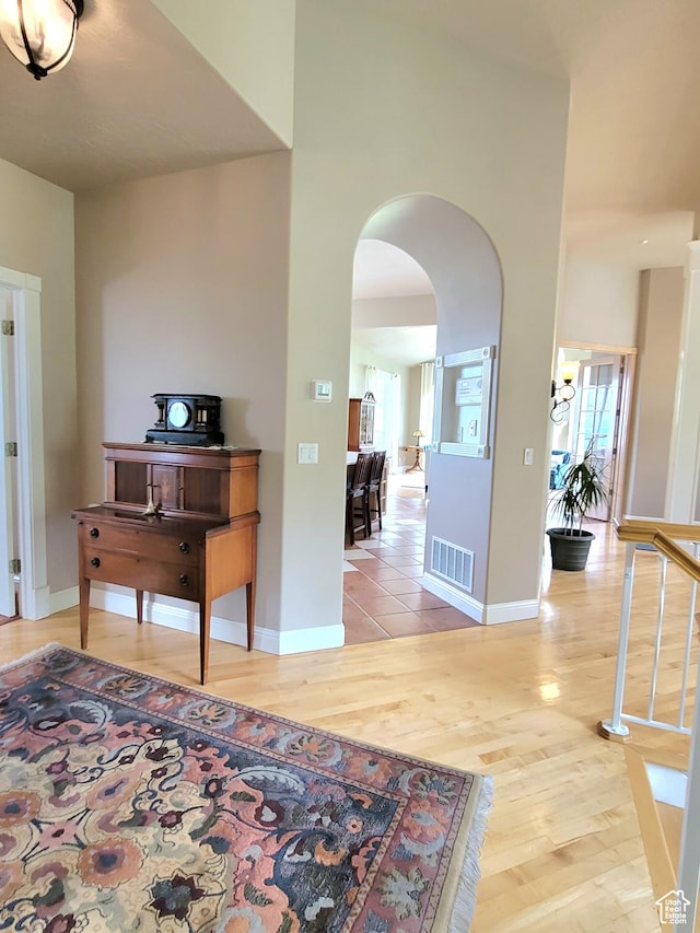 110 W Oak Cir, Woodland Hills, UT 84653 - entryway with arched walkways, baseboards, light wood finished floors, and visible vents
