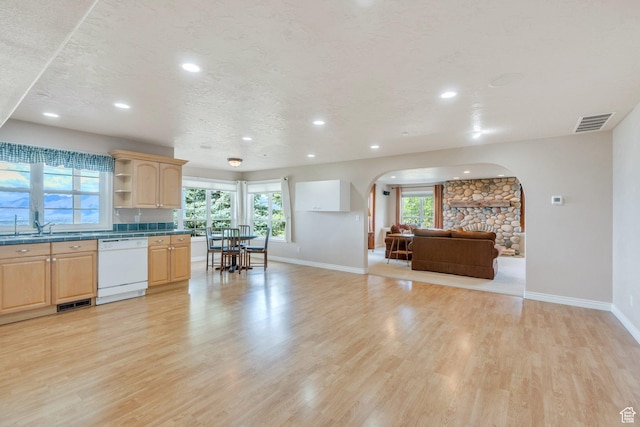 110 W Oak Cir, Woodland Hills, UT 84653 - kitchen featuring visible vents, a sink, light wood-type flooring, arched walkways, and dishwasher