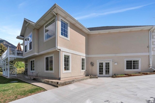 110 W Oak Cir, Woodland Hills, UT 84653 - back of house with french doors, stairs, and stucco siding