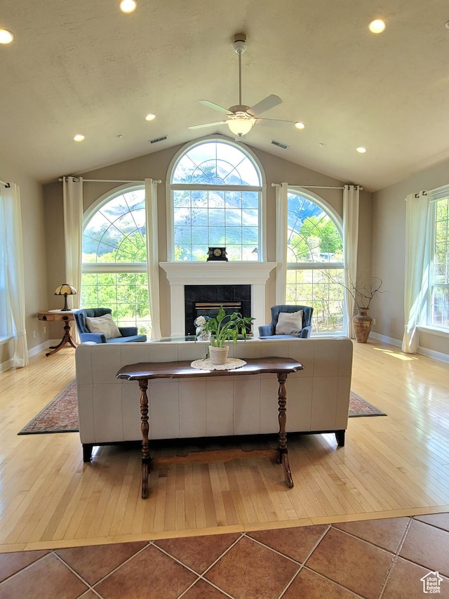 110 W Oak Cir, Woodland Hills, UT 84653 - living room with baseboards, vaulted ceiling, hardwood / wood-style flooring, and a tile fireplace