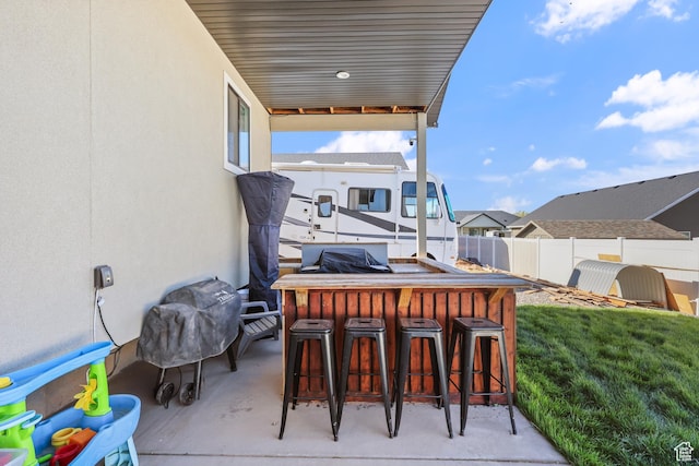 1167 N 150 E Unit 53, Nephi, UT 84648 - view of patio featuring a residential view, fence, and outdoor dry bar