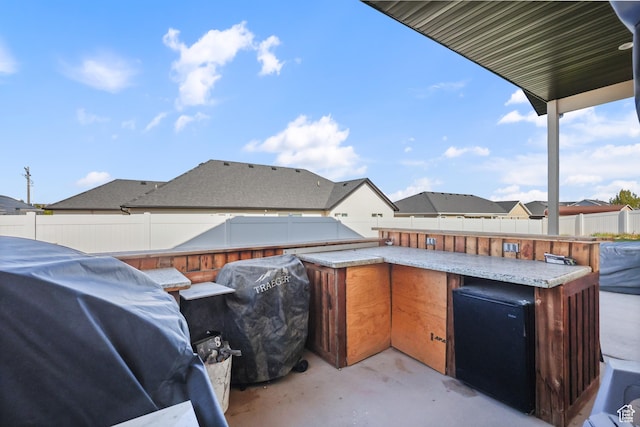 1167 N 150 E Unit 53, Nephi, UT 84648 - view of patio with grilling area, area for grilling, a fenced backyard, and outdoor dry bar