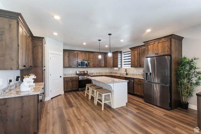 1167 N 150 E Unit 53, Nephi, UT 84648 - kitchen with stainless steel appliances, a center island, a sink, and dark brown cabinets
