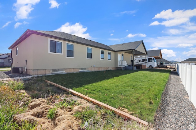 1167 N 150 E Unit 53, Nephi, UT 84648 - rear view of property with central AC unit, fence, and a yard