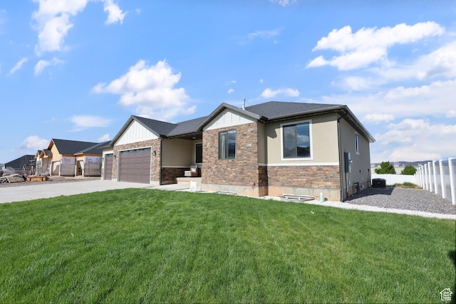 1167 N 150 E Unit 53, Nephi, UT 84648 - prairie-style house with a front yard, fence, concrete driveway, an attached garage, and stone siding