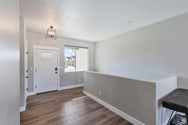 1167 N 150 E Unit 53, Nephi, UT 84648 - entrance foyer with baseboards, dark wood finished floors, and a notable chandelier