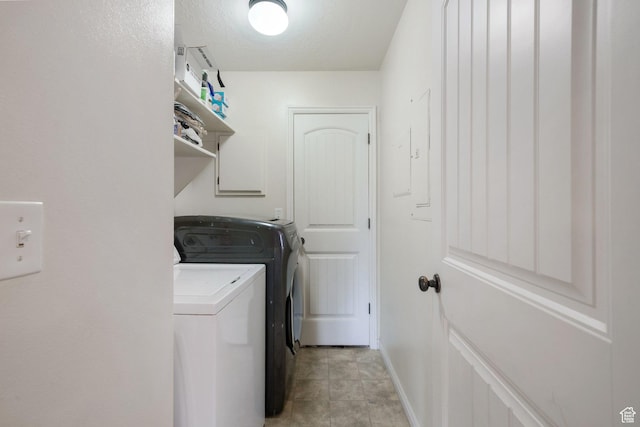 3569 E Rock Creek Rd Unit G2, Eagle Mountain, UT 84005 - laundry room featuring baseboards, laundry area, and washer and clothes dryer