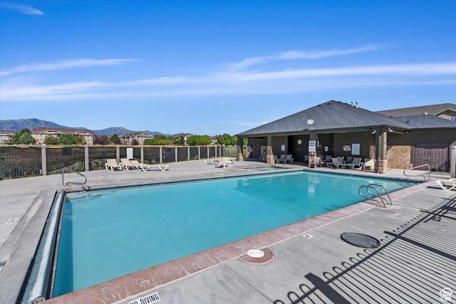 3569 E Rock Creek Rd Unit G2, Eagle Mountain, UT 84005 - pool with a patio area, a mountain view, and fence