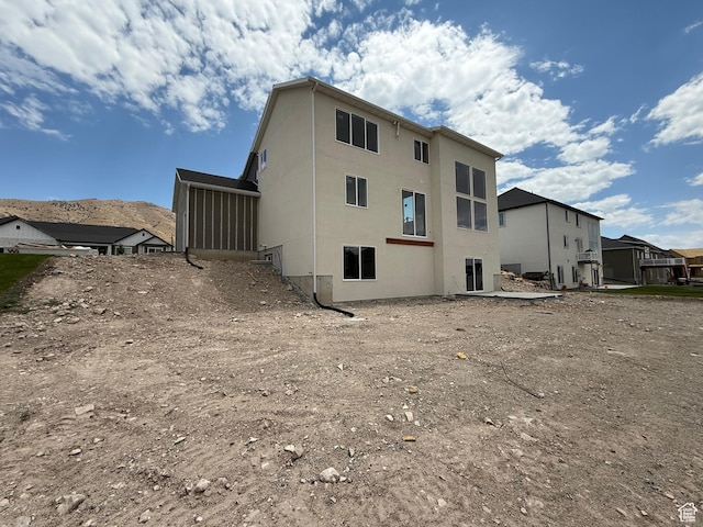 4097 N Ophir Dr, Eagle Mountain, UT 84005 - rear view of property with a sunroom and stucco siding