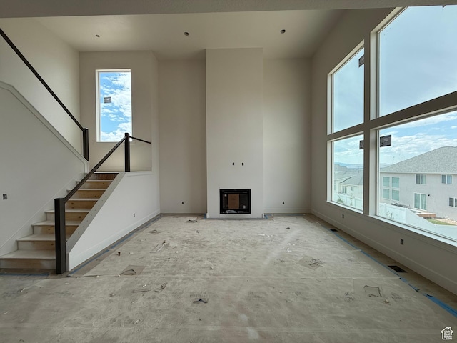 4097 N Ophir Dr, Eagle Mountain, UT 84005 - unfurnished living room with stairway and a fireplace