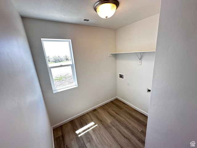 1071 W 400 S Unit 44, Brigham City, UT 84302 - clothes washing area with hookup for a washing machine, baseboards, wood finished floors, and hookup for an electric dryer