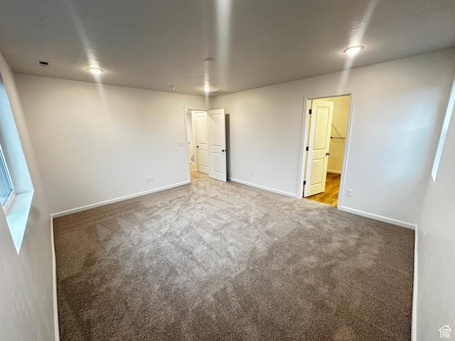 1071 W 400 S Unit 44, Brigham City, UT 84302 - unfurnished room with carpet floors and baseboards