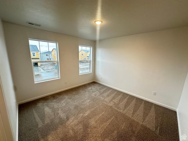 1071 W 400 S Unit 44, Brigham City, UT 84302 - unfurnished room with carpet floors and baseboards