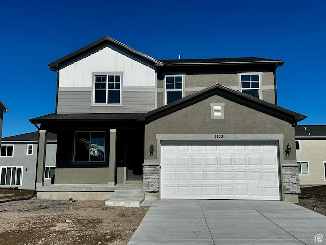 1071 W 400 S Unit 44, Brigham City, UT 84302 - view of front of property with stone siding, driveway, and stucco siding