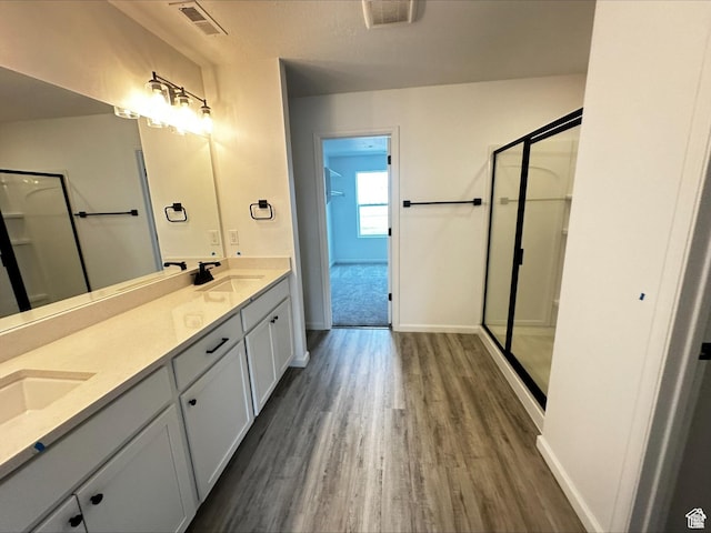1071 W 400 S Unit 44, Brigham City, UT 84302 - full bath with a stall shower, wood finished floors, double vanity, and baseboards