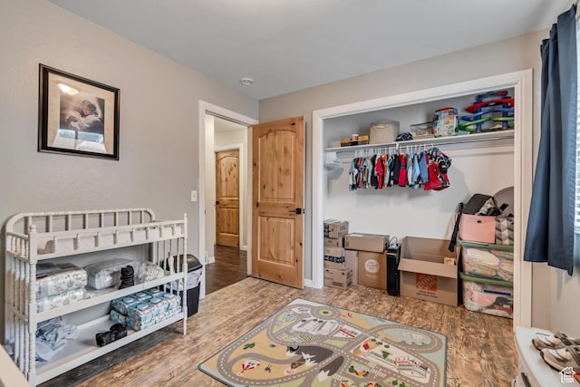 239 Country Club Dr, Stansbury Park, UT 84074 - bedroom with wood finished floors, a closet, and baseboards