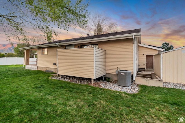 239 Country Club Dr, Stansbury Park, UT 84074 - rear view of property featuring central AC unit