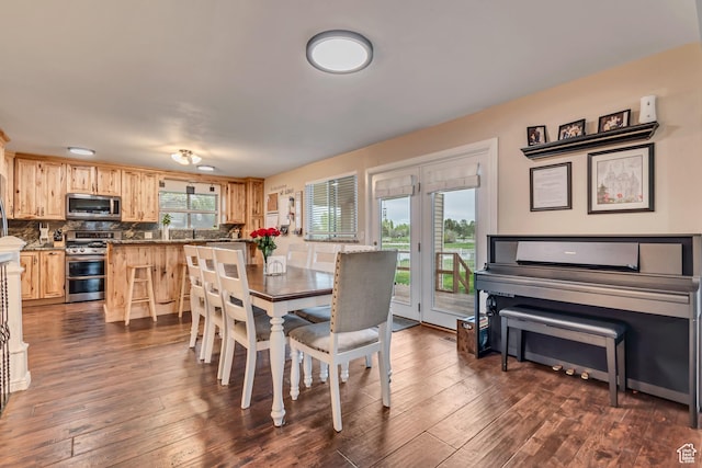239 Country Club Dr, Stansbury Park, UT 84074 - dining space with dark wood-style flooring