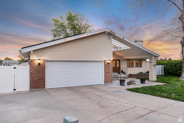 239 Country Club Dr, Stansbury Park, UT 84074 - mid-century modern home with brick siding, driveway, and fence