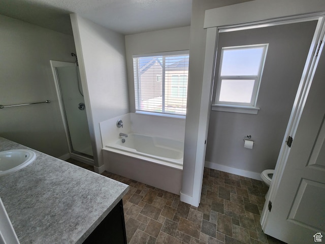 113 N Granite Park Dr, Saratoga Springs, UT 84045 - bathroom featuring vanity, a shower stall, a bath, and stone finish flooring