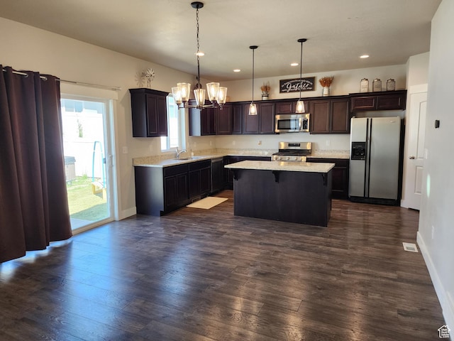 113 N Granite Park Dr, Saratoga Springs, UT 84045 - kitchen featuring appliances with stainless steel finishes, a sink, a chandelier, a center island, and recessed lighting
