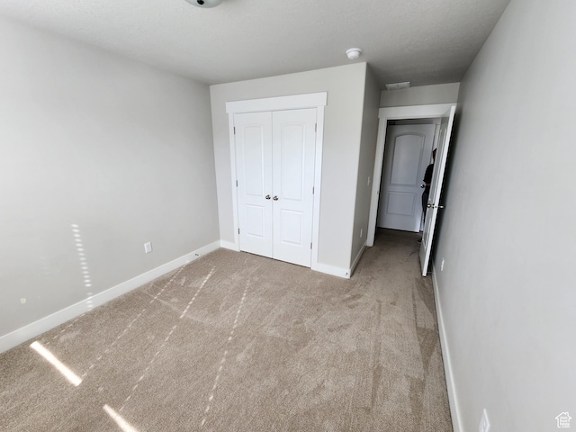 113 N Granite Park Dr, Saratoga Springs, UT 84045 - unfurnished bedroom with carpet flooring, a closet, and baseboards