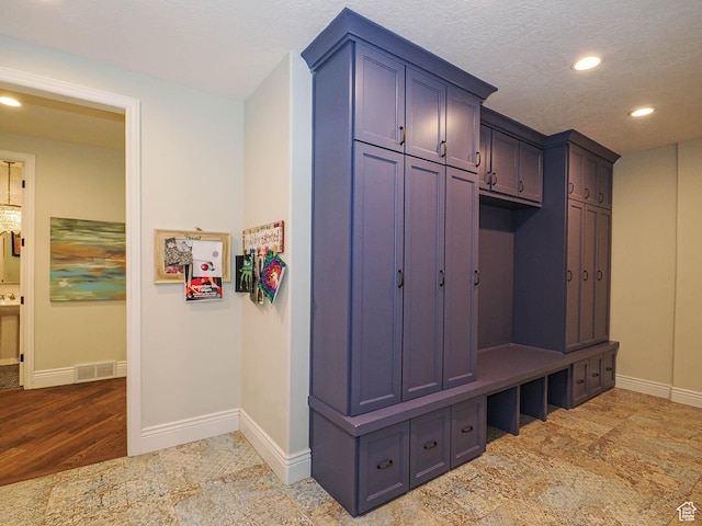 mudroom featuring recessed lighting, baseboards, visible vents, and light wood-style flooring