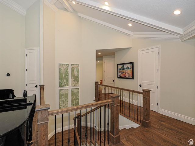 hallway featuring wood finished floors, baseboards, an upstairs landing, vaulted ceiling with beams, and recessed lighting