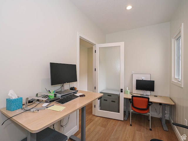 office space featuring light wood-style floors and recessed lighting