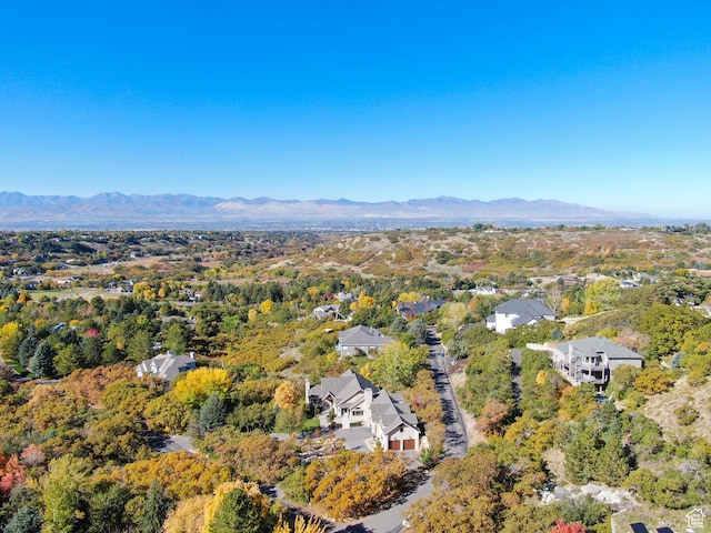 birds eye view of property featuring a mountain view