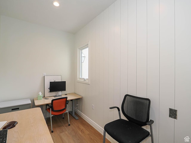 office space featuring baseboards, recessed lighting, and light wood finished floors