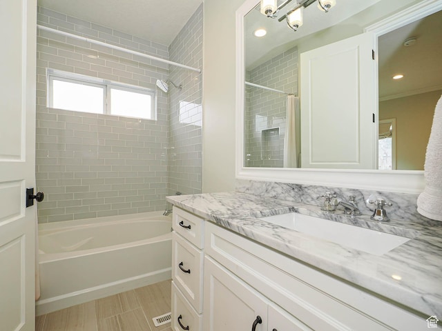 bathroom featuring shower / bath combo with shower curtain, recessed lighting, and vanity