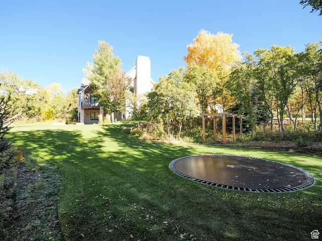 view of yard featuring a trampoline