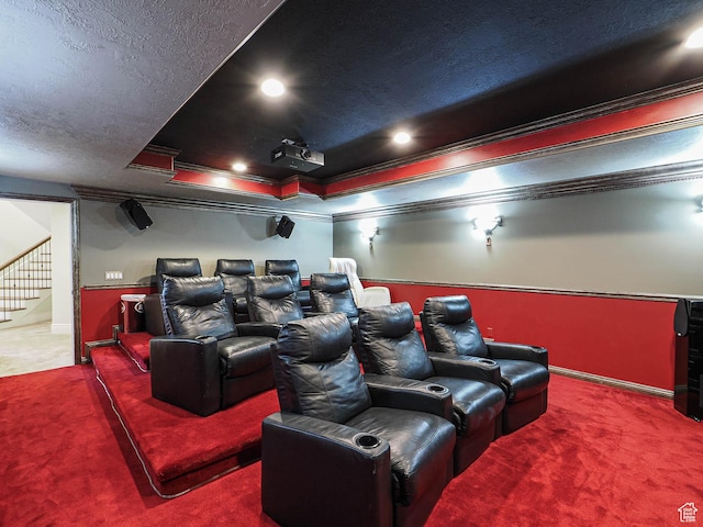 home theater with carpet floors, recessed lighting, a textured ceiling, and ornamental molding