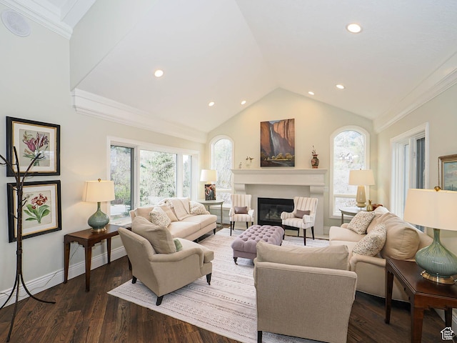 living area featuring dark wood-style flooring, recessed lighting, vaulted ceiling, and a glass covered fireplace