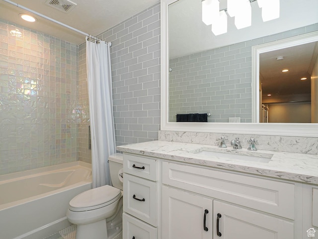 bathroom featuring tile walls, shower / tub combo with curtain, toilet, and visible vents