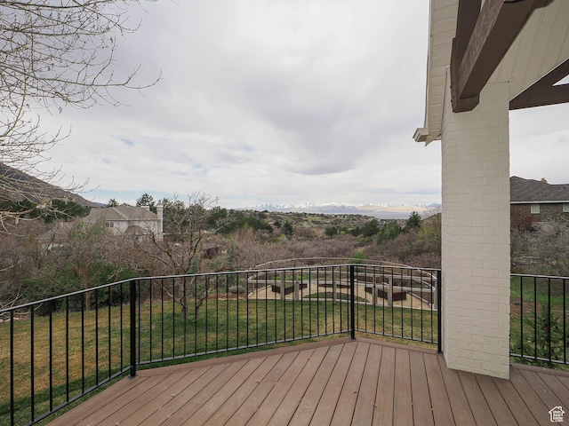 wooden deck with a lawn