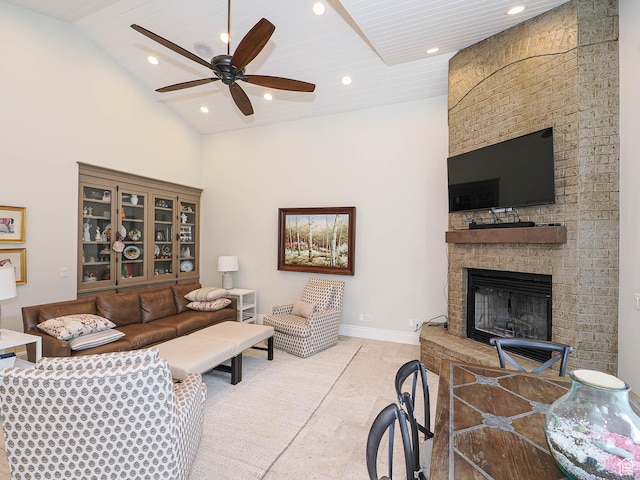 living area featuring a ceiling fan, a fireplace, high vaulted ceiling, baseboards, and recessed lighting
