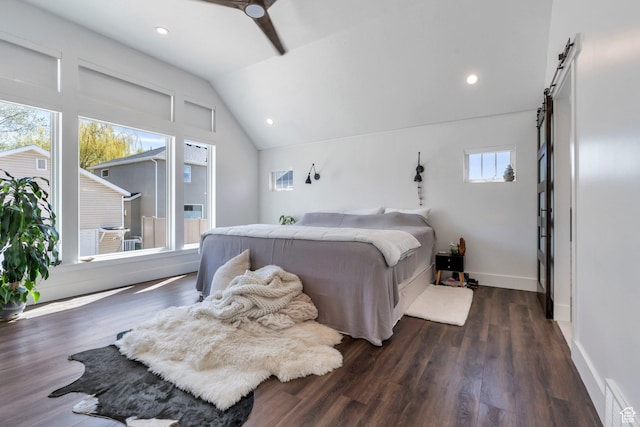 654 N 200 E, American Fork, UT 84003 - bedroom featuring a barn door, dark wood finished floors, baseboards, vaulted ceiling, and visible vents