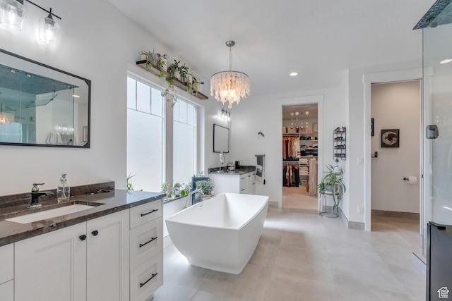 654 N 200 E, American Fork, UT 84003 - bathroom with a freestanding bath, a shower stall, two vanities, a sink, and a notable chandelier