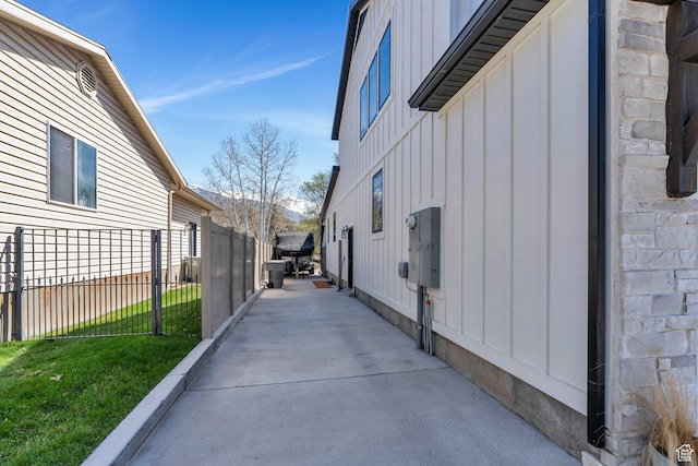 654 N 200 E, American Fork, UT 84003 - view of property exterior featuring fence, board and batten siding, and a yard
