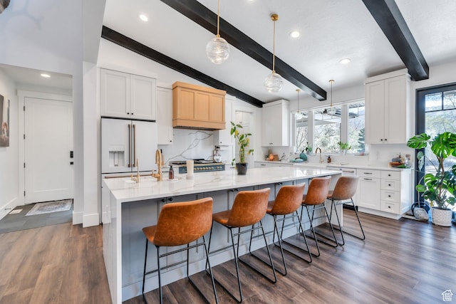 654 N 200 E, American Fork, UT 84003 - kitchen featuring lofted ceiling with beams, a breakfast bar area, white cabinetry, decorative light fixtures, and dark wood-type flooring