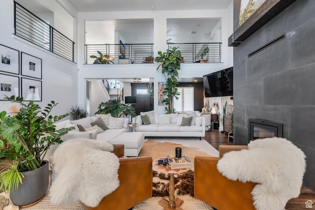 654 N 200 E, American Fork, UT 84003 - living room with a towering ceiling, wood finished floors, and a tile fireplace