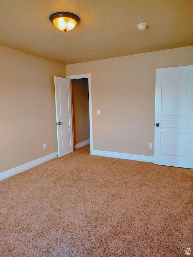 3641 W Canyon Lands Dr, Riverton, UT 84065 - spare room featuring baseboards and light carpet