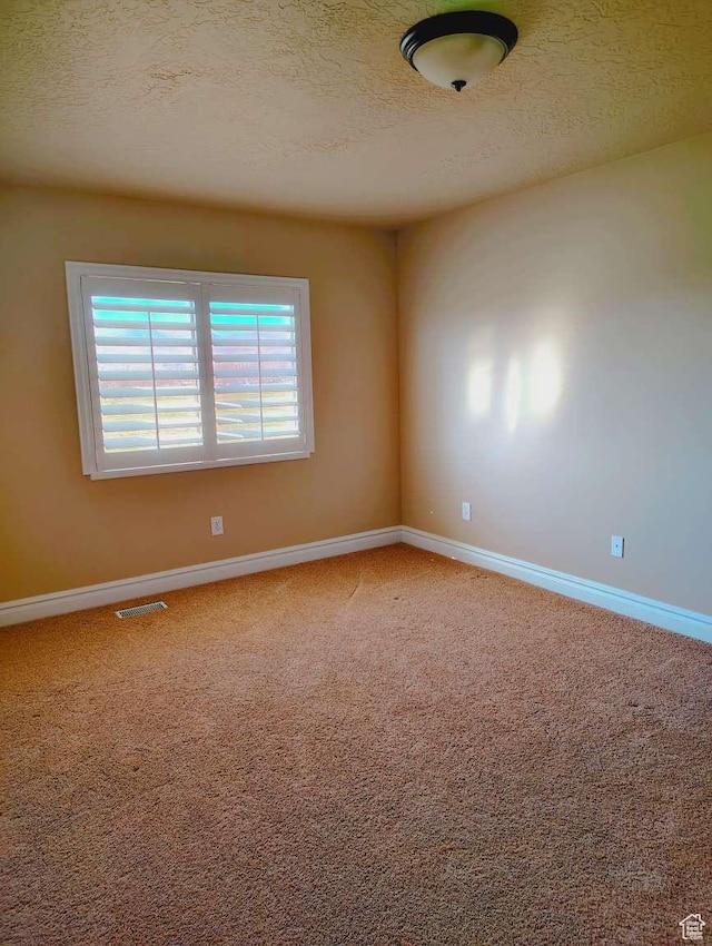 3641 W Canyon Lands Dr, Riverton, UT 84065 - spare room featuring visible vents, a textured ceiling, carpet floors, and baseboards