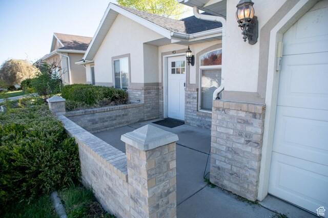 1409 S 30 E, Payson, UT 84651 - view of exterior entry featuring roof with shingles, covered porch, and stucco siding