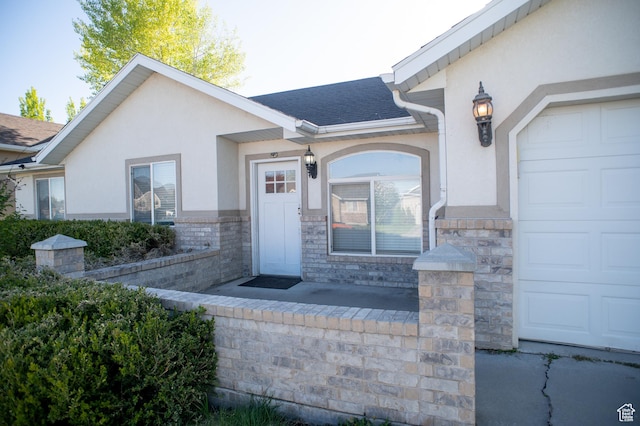 1409 S 30 E, Payson, UT 84651 - property entrance featuring a shingled roof, stucco siding, an attached garage, and stone siding